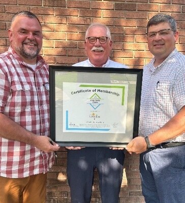DIPRA Regional Engineer Paul Hanson (center) presents a certificate to Dustin Sailor (right), Director of Public Works and Utilities for the City of Goshen, and Marvin Shepherd (left), the city's Water and Sewer Superintendent, inducting the city into the Century Club, which honors a six- to seven-mile length of 6-inch cast iron pipe that remains in service in the city's drinking water distribution system.