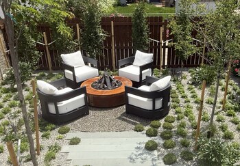 Cozy backyard with a Breck Ironworks Fire Pit