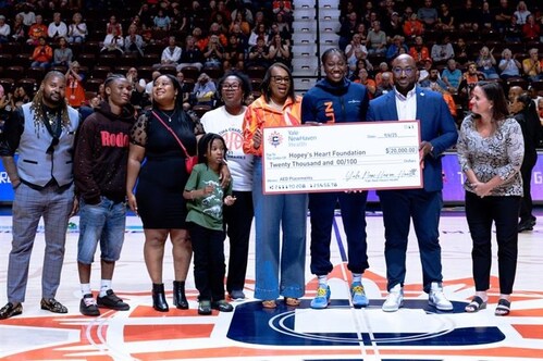 Yale New Haven Health representatives surprised Connecticut Sun center and Hopey’s Heart founder Tina Charles with a check presentation during pregame of the Sun’s September 6 matchup against the Phoenix Mercury.