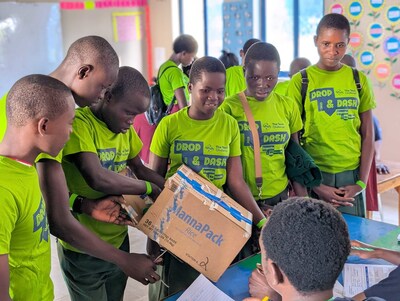 A team of students explains and demonstrates their device to a panel of volunteer judges at The Tech Challenge Kenya 2025.
