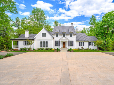 The handsome residence sits on 6.7 manicured acres comprised of manicured lawns, mature foliage and centuries-old trees. Its three living levels are designed to blend historic charm with modern amenities and finishes. VirginiaLuxuryAuction.com.