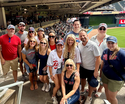 Minneapolis teams from Roth Staffing Companies gather for their monthly in-person team outing to cheer on the Minnesota Twins.