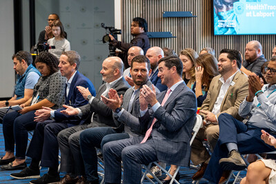 Attendees celebrating the HealthTrackRx UPS Healthcare at Labport Ribbon Cutting