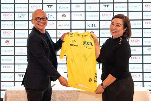 Dennis Ng, Executive Chairman of Embed Financial Group Holdings, and Agnes Goh, Managing Director of Evoke EXP, pose with a signed Yellow Jersey from champion cyclists Tadej Pogačar and Jonas Vingegaard.  PHOTO: Evoke EXP Dennis Ng, Executive Chairman of Embed Financial Group Holdings, and Agnes Goh, Managing Director of Evoke EXP, pose with a signed Yellow Jersey from champion cyclists Tadej Pogačar and Jonas Vingegaard.  PHOTO: Evoke EXP
