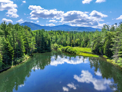 Pictured here is one of the property’s two lakes, which feeds into Frenchs Brook and offers views of Whiteface Mountain. The owners have stocked the lakes with bass and rainbow trout in previous years. NewYorkLuxuryAuction.com.