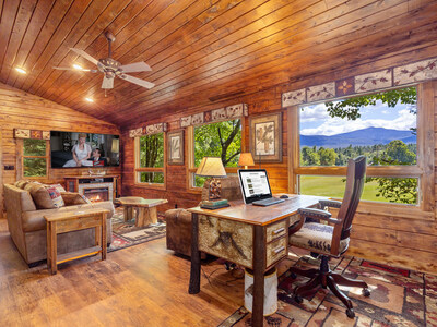 The property includes 3 living structures: a main house, guest cabin and guest cottage. Shown here is the main living area of the cottage (currently outfitted as an office suite), the most recently built structure (2018) on the property. The other living quarters were originally built in 1838 (main house) and 1955 (guest cabin) and later renovated. NewYorkLuxuryAuction.com.