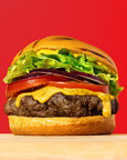 A classic cheeseburger stacked with fresh lettuce, tomato, onion, melted cheddar and mustard on a toasted bun; Photo Credit: Ingredient
