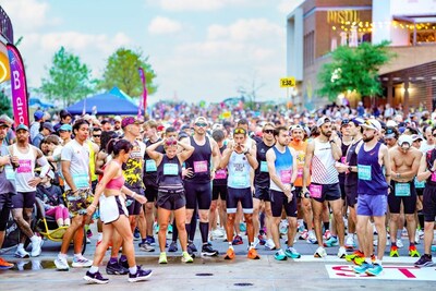 A sea of runners at the Irving Marathon start line, set to kick off race day