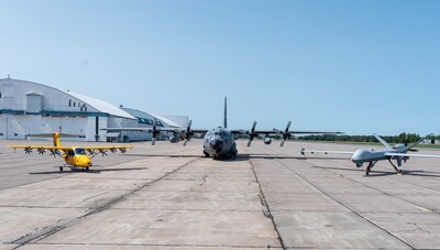 Electra’s EL2 Ultra-STOL prototype aircraft (left) pictured with the Connecticut Air National Guard 103rd Air Wing’s C-130 and the New York Air National Guard 174th Attack Wing’s MQ-9 following participation in Air Force Research Lab’s Future Flag 25-3 Test Event in Rome, NY. (Credit: Electra)