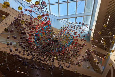 'Magnetic Field,' a sculpture of metal rods and glass spheres by Damián Ortega that echoes the shape of the Earth's magnetic field, hangs in the atrium of the Robert Day Sciences Center at Claremont McKenna College. Photo: Anibal Ortiz/CMC