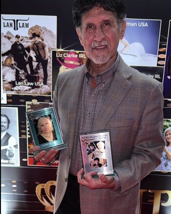 JMF holds Pepper Jay's Producer of the Year award and his award for Collaboration of the Year for "Workin' My Way to Nashville"
