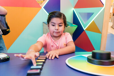 A child plays with a sound feature at the YMCA of Greater San Antonio's new IMAGINATION STATION: Immerse Yourself In Play permanent installation at the Mays Family YMCA at Potranco.