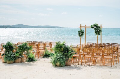Pictured here, a beachside setup at Sandals South Coast in Jamaica, inspired by Sandals Resorts’ Nature’s Vow destination wedding concept and enhanced with potted plants that add vibrant greenery and a touch of the Caribbean’s natural beauty to every detail.