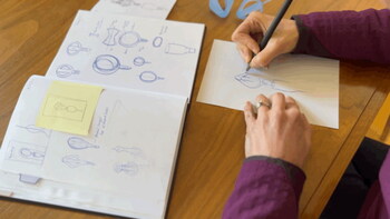 Inventor Carly Price sketching the product.