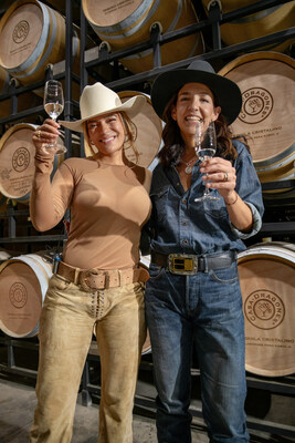 Karol G and Bertha Gonzalez Nieves toasting to 200 Copas by Casa Dragones
