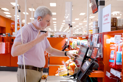 Steve Decker, senior manager, user experience accessibility, Target, uses Target’s accessible self-checkout, guided by audio prompts and tactile controls.