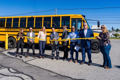 (L-R): Maggie Clancy, Executive Vice President of U.S. EV Sales and Marketing, Zenobē; Hugh Reece, PMP Program Manager, National Grid; Rachel Ackerman, Program Director, Clean Transportation, MassCEC; Ralph L. Carrero, Superintendent, Lawrence Public Schools; Hank Webster, Director of Climate Strategy, Department of Environmental Protection; Brian De Peña, Mayor of Lawrence, Massachusetts; Scott Sheridan SVP Operations, Beacon Mobility/NRT Bus; Lynda Gomez, Senior Operations Manager, NRT Bus