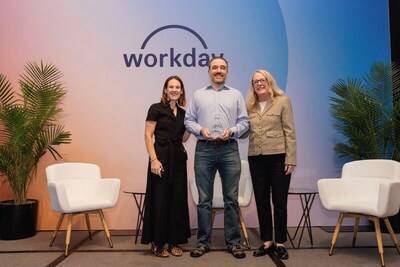 Workday's Alison Natali (left) and Patrice Cappello (right)  present the award to Justin Junkel on behalf of Pinnacle Group during Workday Rising