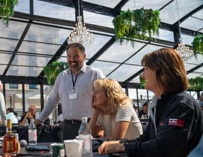 Optiline Enterprises CEO, Leo Marchesseault, engages in conversation with colleagues at a company-wide meeting. (CNW Group/Optiline Enterprises)