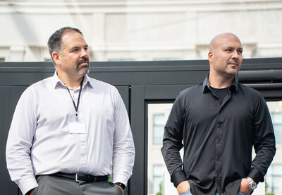 Optiline Enterprises CEO, Leo Marchesseault, and co-founder, Tommy Bolduc, address employees during a company-wide meeting. (CNW Group/Optiline Enterprises)