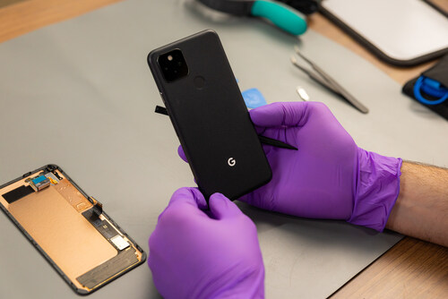 Hands-on smartphone repair: a Google Pixel device being serviced by a certified uBreakiFix by Asurion repair technician.