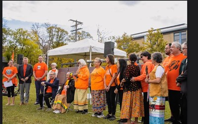 Survivors, dignitaries and guests gather in front of the newly unveiled Historic Sites and Monuments Board of Canada plaques commemorating the former Assiniboia Residential School as part of the Indian Residential School National Historic Event © Parks Canada (CNW Group/Parks Canada (HQ))