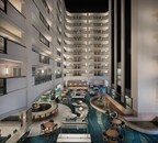 The reimagined atrium lobby creates a welcoming gathering space with flowing river-inspired patterns.