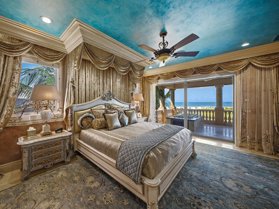 Located on the uppermost living level, the primary bedroom suite includes a private, oceanfront terrace, dual closets, and a large bathroom with soaking tub, shower with rainfall heads, custom urinal and overhead skylight. OceanfrontLuxuryAuction.com.