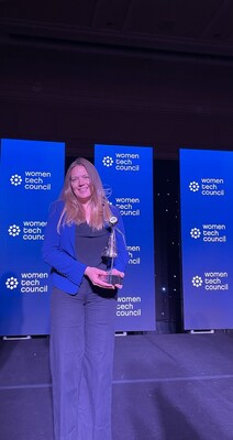 Dr. Kathryn Armstrong receives the Leadership Excellence Award from the Women in Tech Council