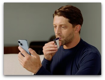 Demonstration of how to take a breathalyzer test with the BACtrack View system