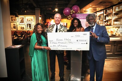 The Atlanta Fibroid Center marked its 20-year anniversary with a celebration that raised $15,000 for Hosea Helps to support area families who are food insecure. Pictured (L-R): Elisabeth Williams-Omilami, CEO, Hosea Helps; Dr. John Lipman, Atlanta Fibroid Center; Lydia Pierre, The Corporate Socialite®, Ambassador & Mistress of Ceremonies; and Afemo Omilami, COO, Hosea Helps.
