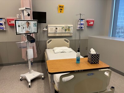 A Caregility APS250 mobile telehealth cart positioned by the patient’s bed in the Drexel University simulation lab allows remote nurses to engage with patients virtually.