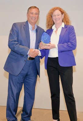 Caregility President Mike Brandofino awards Kate Morse, PhD, MSN, RN, Assistant Dean of Simulation and Innovation at Drexel University, with a Community Impact Award at the 2025 Caregility Summit.