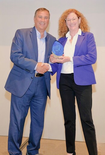 Caregility President Mike Brandofino awards Kate Morse, PhD, MSN, RN, Assistant Dean of Simulation and Innovation at Drexel University, with a Community Impact Award at the 2025 Caregility Summit.