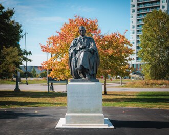 Statue of Sir Arthur Doughty officially installed at Library and Archives Canada&#8217;s Preservation Campus (CNW Group/Library and Archives Canada)