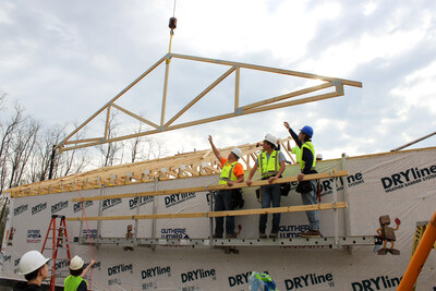 Students assembling wood framing at Oakland Schools Technical Campus BYF