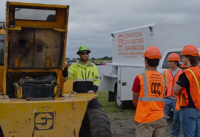 Students talking with mechanic at North Branch BYF