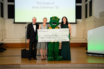 McDaniel Board of Trustees Chair Bruce Preston, McDaniel President Julia Jasken, Green Terror, and McDaniel student Nicki James with an oversized check for $15 million from the late Jonas Eshelman, Class of 1950