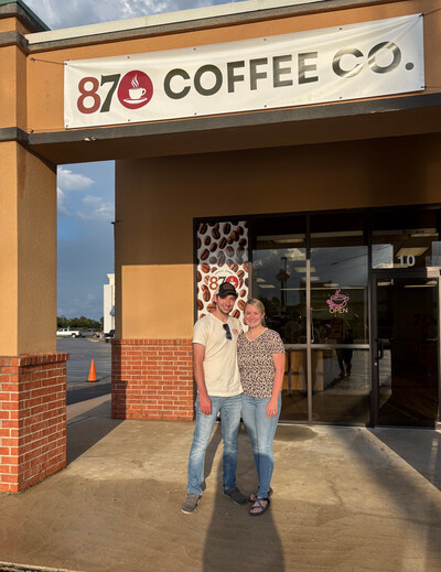 Owners Myka and Caleb Huett at the entrance of their new 870 Coffee Co. at 10 Paul Wood Lane, Mountain Home, Ark.