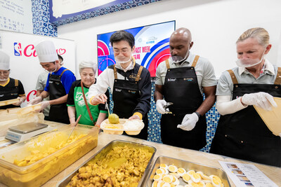 Volunteers help box lunches to distribute to the community in the third event of the “NBA Cares x Sands Cares Community Impact Week,” held Friday at the Fuhong Society of Macau’s Pou Choi Centre.