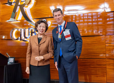 Rutgers Business School Dean Lei Lei poses with Rutgers MBA alumnus Brian Smith during a recent alumni awards ceremony.