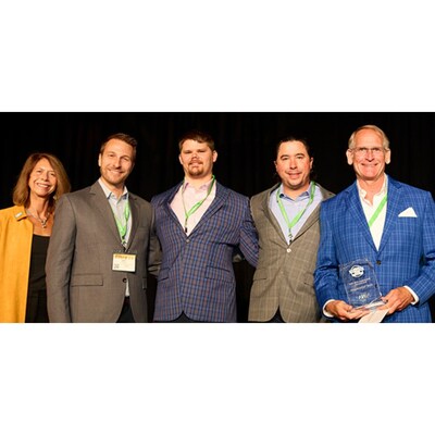 Al Cheswick, KrellTech president, and his team accept 
