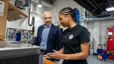 Valvoline Global Operations President and Chief Executive Officer, Jamal Muashsher, with a student from the Hub for Innovative Learning and Leadership in Lexington, Ky.