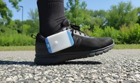 The Heel2Toe&#8482; device, developed by PhysioBiometrics, clips to the side of a shoe and gives auditory feedback to encourage better walking. (CNW Group/AGE-WELL)