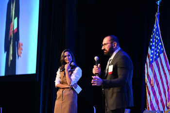 Andrea Virgin, Chair & CEO of The Center and Dr. Marco Pistoia, SVP of Industry Relations at IonQ demonstrate the basic elements and applications of quantum technology at Quantum Beach 2025.