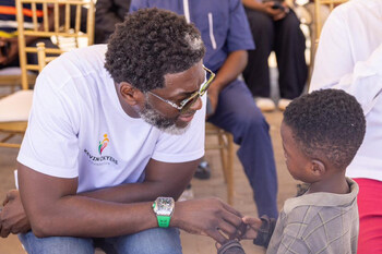 Kevin Okyere interacting with community members during the Foundation World Food Day Outreach