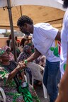 Kevin Okyere interacting with community members during the Foundation World Food Day Outreach