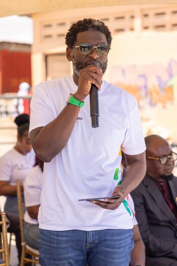 Kevin Okyere interacting with community members during the Foundation World Food Day Outreach
