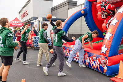To celebrate the grand re-opening, families enjoyed a tailgate-themed celebration with food, games and treats served by the Our Family® food truck.
