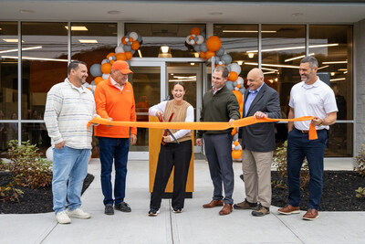 NYCM leadership, joined by local and state officials, cut the ribbon to their updated Sherburne, NY location.